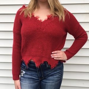 Red frayed sweater